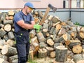 Muscular young man chopping logs Royalty Free Stock Photo