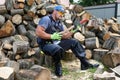 Muscular young man chopping logs Royalty Free Stock Photo