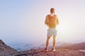 Muscular young man climbed up the mountain Royalty Free Stock Photo