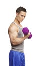 Muscular young man exercising in sports outfit Royalty Free Stock Photo