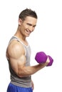 Muscular young man exercising in sports outfit Royalty Free Stock Photo