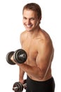 Muscular young man lifting a dumbbell Royalty Free Stock Photo