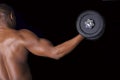 Muscular young man lifting weights Royalty Free Stock Photo