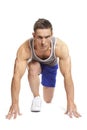 Muscular young man ready to race in sports outfit Royalty Free Stock Photo