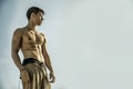 Muscular young man shirtless against the sky Royalty Free Stock Photo