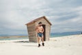 Muscular young man standing near the wooden house Royalty Free Stock Photo