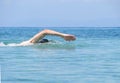 Muscular young man swimming freestyle Royalty Free Stock Photo