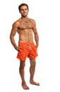 Muscular young man in swimwear standing Royalty Free Stock Photo