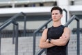 Muscular young man. workout routine. An athlete is resting tired after training. Sport watch on hand. Device For Sports Royalty Free Stock Photo