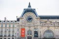 Musee d`Orsay or Orsay museum building facade with clock in a cloudy day in Paris, France