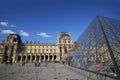 Musee du Louvre, the Illuminated attractive museum in nice sunny day, glassed pyramid in europe, Paris, France, tourist