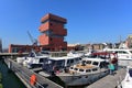 Museum aan de Stroom (MAS) located along river Scheldt is a 60m tall building designed by Neutelings Riedijk Architects