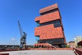 Museum aan de Stroom (MAS) located along river Scheldt is a 60m tall building designed by Neutelings Riedijk Architects