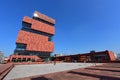 Museum aan de Stroom (MAS) located along river Scheldt is a 60m tall building designed by Neutelings Riedijk Architects