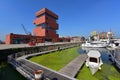 Museum aan de Stroom (MAS) located along river Scheldt is a 60m tall building designed by Neutelings Riedijk Architects