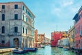 Chioggia cityscape with narrow water canal Vena with moored multicolored boats