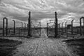 Museum Auschwitz - Birkenau. Holocaust Memorial Museum. Barbed wire and fance around a concentration camp. Royalty Free Stock Photo