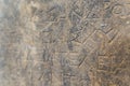 Museum concept. Closeup shot of a stone wall with graved greek language. Ancient messages on the walls.