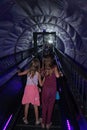 Museum of Illusion, Wien - aug 2019: A little girl walks along the warp hole Royalty Free Stock Photo