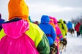 mushers dressed in brightly colored parkas for visibility Royalty Free Stock Photo