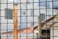 Mushroom barbed wire cage inside detention Within steel cage, nick iron net wall wire metal square grid fence to prevent Royalty Free Stock Photo