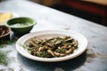 mushroom caps with pesto, pine nuts, ceramic dish