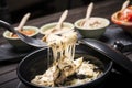 Mushroom cheese fondue with dips in background Royalty Free Stock Photo