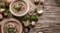 Mushroom cream soup in ceramic bowls on rustic wooden table Royalty Free Stock Photo