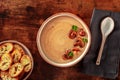 Mushroom cream soup with toasted bread, on a rustic wooden background Royalty Free Stock Photo