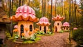 Mushroom houses in a colorful forest. Royalty Free Stock Photo