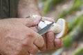 Mushroom hunter cleans a boletus