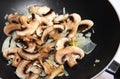 Mushroom onion stir-fry in wok
