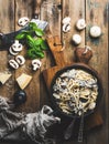Mushroom pasta spaghetti in iron pan served with parmesan, basil Royalty Free Stock Photo