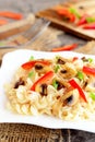 Mushroom pasta with vegetables on a plate. Vegetarian recipe. Homemade healthy food. Closeup Royalty Free Stock Photo