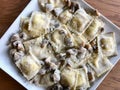 Mushroom Ravioli Pasta with Cream Sauce in Rectangular Plate