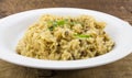 Mushroom risotto rice close up on rustic wood Royalty Free Stock Photo