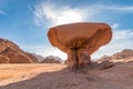 Mushroom rock formation against sun, Wadi Rum desert, Jordan Royalty Free Stock Photo