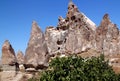 Mushroom-shaped rocks with caves inside in the Rose Valley between the towns of Goreme and Cavusin in Cappadocia Royalty Free Stock Photo