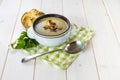 Mushroom soup with a bread roll and parsley Royalty Free Stock Photo