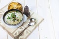 Mushroom soup with a bread roll and parsley Royalty Free Stock Photo