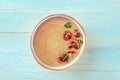 Mushroom soup, garnished with parsley, shot from above on a wooden background Royalty Free Stock Photo