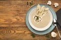 Mushroom soup with parsley on rustic wooden table Royalty Free Stock Photo