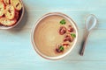 Mushroom soup in a rustic bowl with toasted bread, shot from the top Royalty Free Stock Photo
