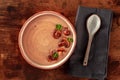 Mushroom soup with a spoon, on a dark rustic wooden background Royalty Free Stock Photo