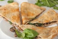 Mushroom spinach quesadilla on white plate Royalty Free Stock Photo