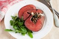 Mushroom and spinach stuffed beef heart with arugula Royalty Free Stock Photo