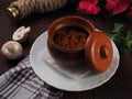 Mushroom stew with vegetables and raw mushrooms on the background Royalty Free Stock Photo