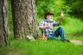 Mushrooming in forest, Grandfather hunting mushrooms over summer forest background. Mushroomer gathering Mushroom Royalty Free Stock Photo