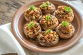 Mushrooms' caps stuffed with cheese, onion and butter