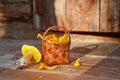 Mushrooms chanterelles collected in a basket handmade. Basket of lime bark with mushrooms, standing on an old wooden background Royalty Free Stock Photo